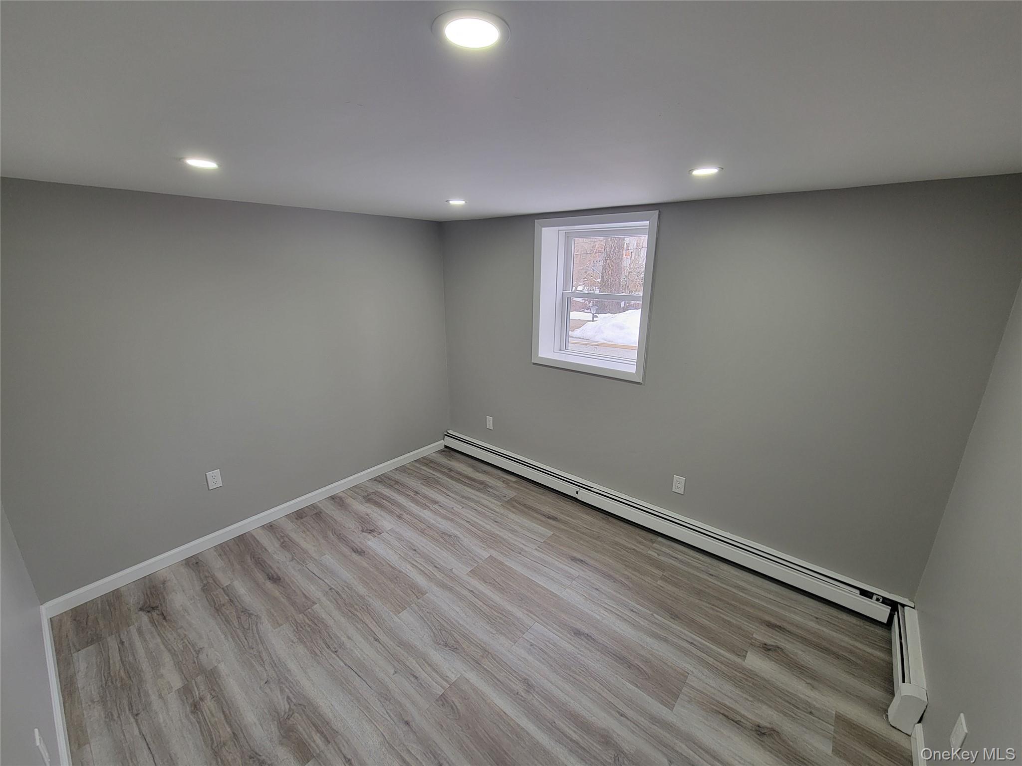 96 Hallock Landing Road Rocky Point, NY 11778 - Photo 7 of 13 a view of empty room with wooden floor