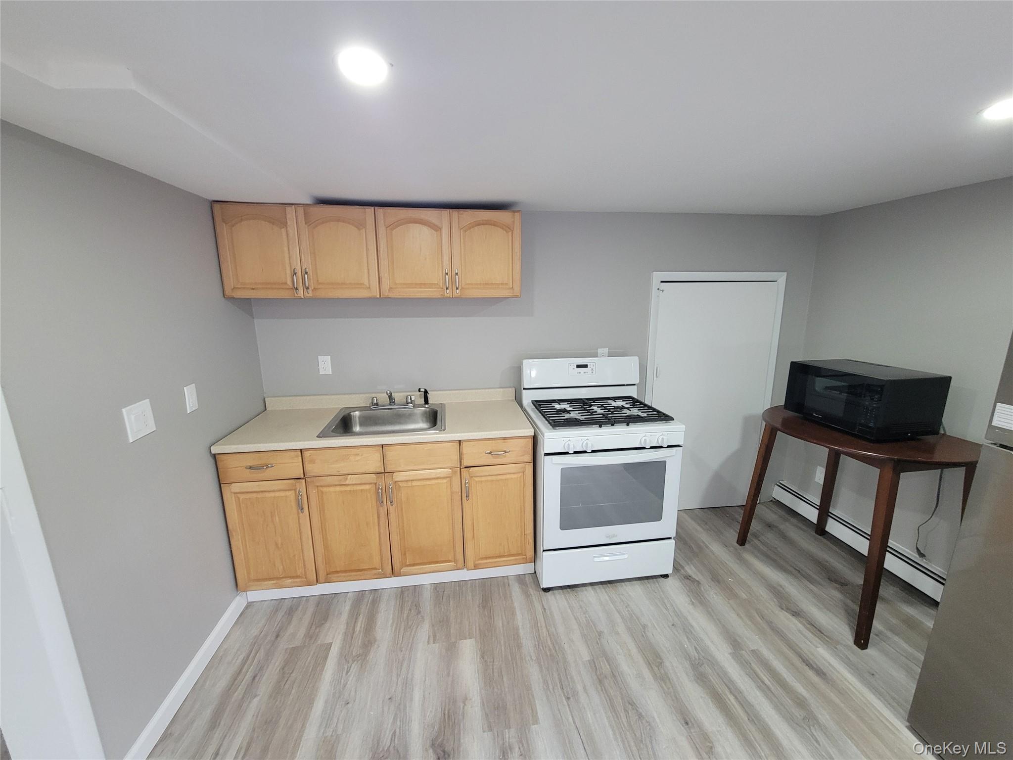 96 Hallock Landing Road Rocky Point, NY 11778 - Photo 10 of 13 a view of kitchen with sink and cabinets