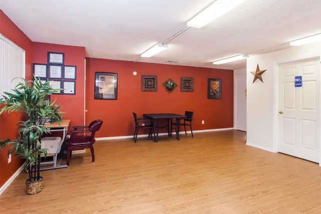 a view of livingroom with furniture and a potted plant