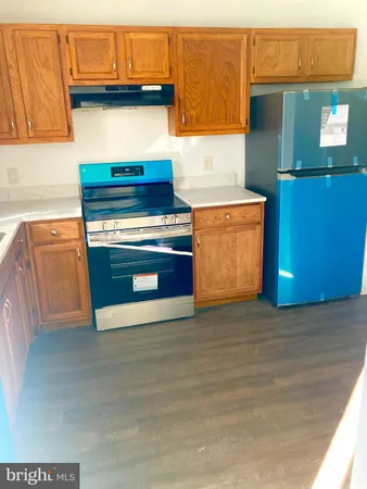 a kitchen with granite countertop a stove and a cabinets