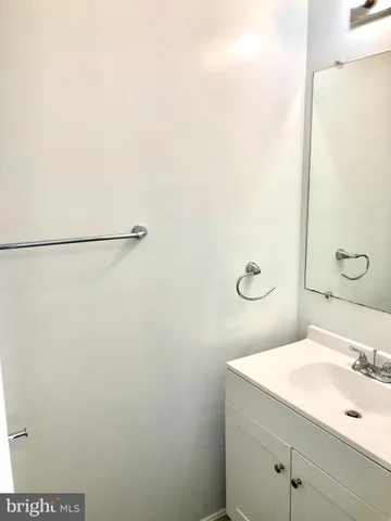 a bathroom with a sink and mirror