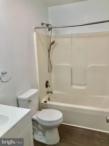 a bathroom with a toilet a sink and a bathtub