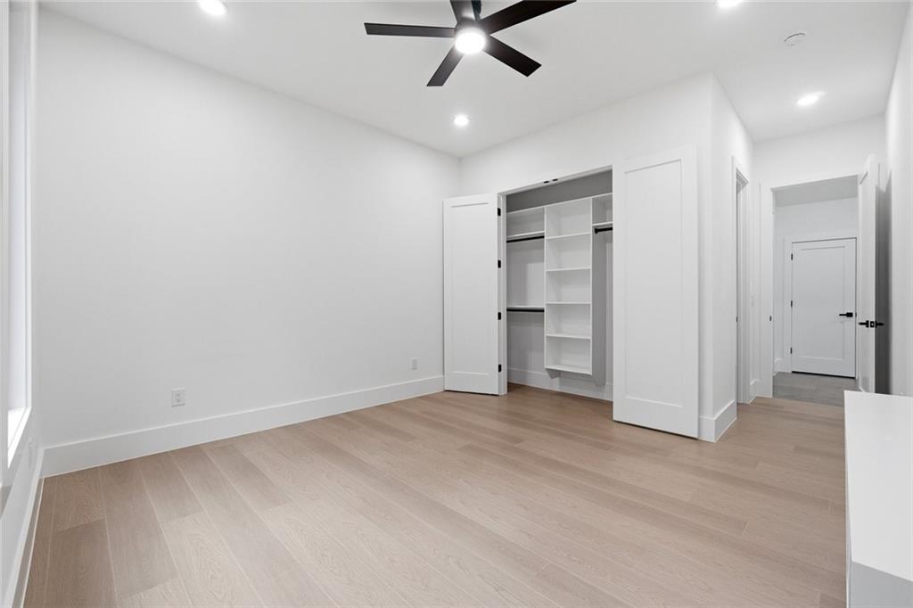 1563 Whitley Road Dacula, GA 30019 - Photo 23 of 44 an empty room with closet and a ceiling fan