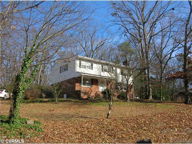 11451 Rolling Brook Road Chester, VA 23831 - Photo 1 of 11 a view of a house with a yard covered in snow