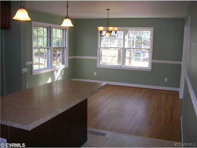 11451 Rolling Brook Road Chester, VA 23831 - Photo 3 of 11 wooden floor in an empty room with a window