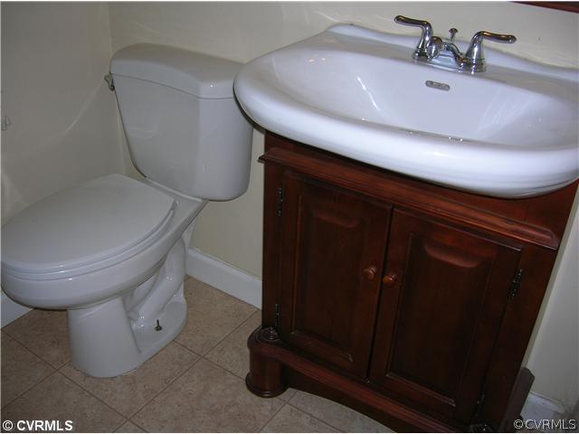 11451 Rolling Brook Road Chester, VA 23831 - Photo 7 of 11 a bathroom with a toilet and a sink