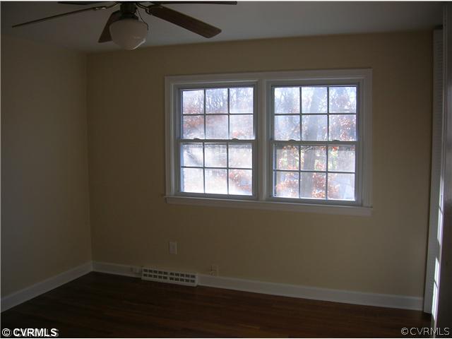 11451 Rolling Brook Road Chester, VA 23831 - Photo 8 of 11 an empty room with a window