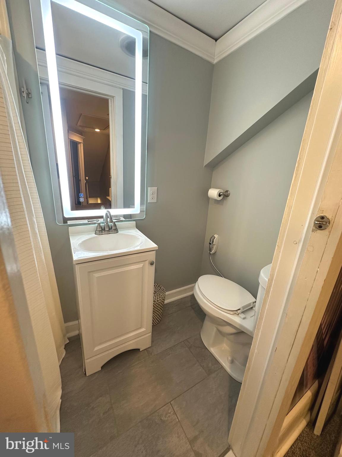 723 Newportville Road Croydon, PA 19021 - Photo 15 of 23 a bathroom with a toilet a sink and a mirror