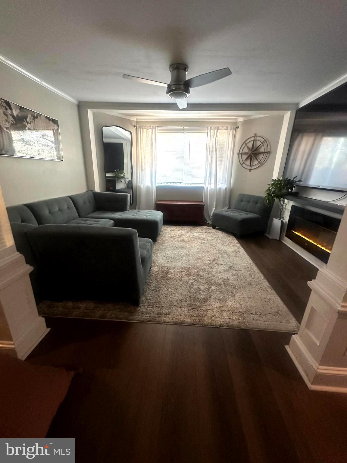 723 Newportville Road Croydon, PA 19021 - Photo 2 of 23 a living room with fireplace furniture and a flat screen tv