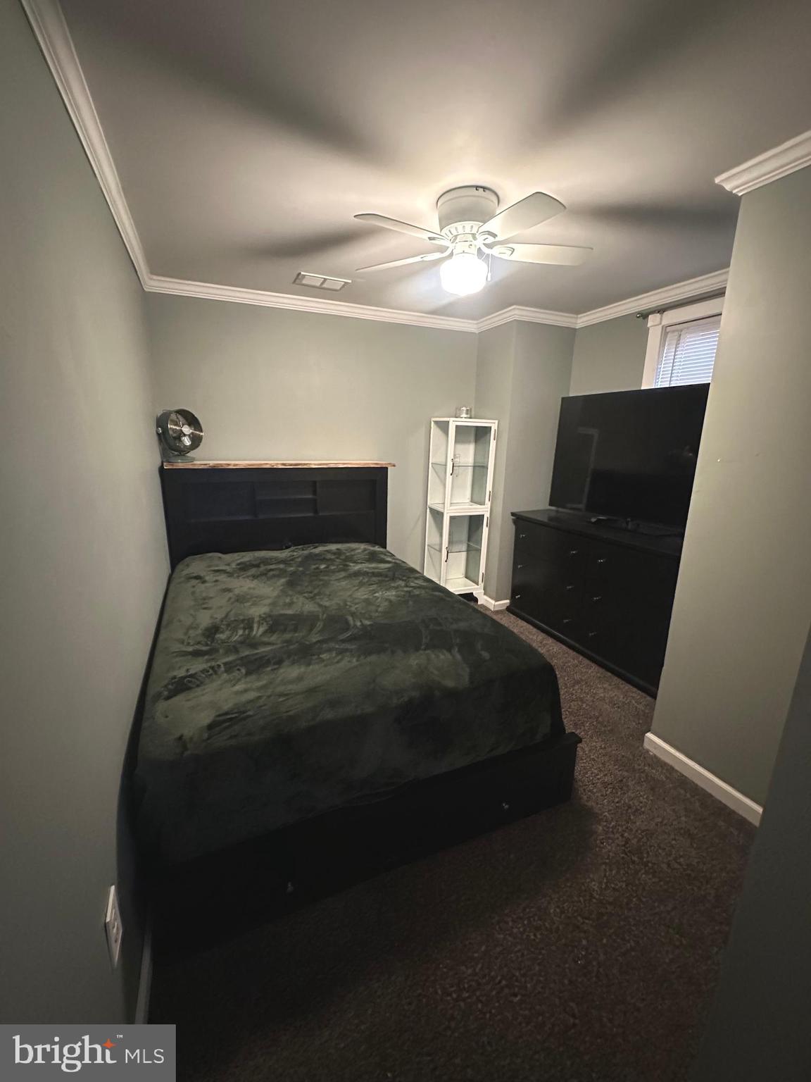 723 Newportville Road Croydon, PA 19021 - Photo 7 of 23 a bedroom with a bed and a chandelier