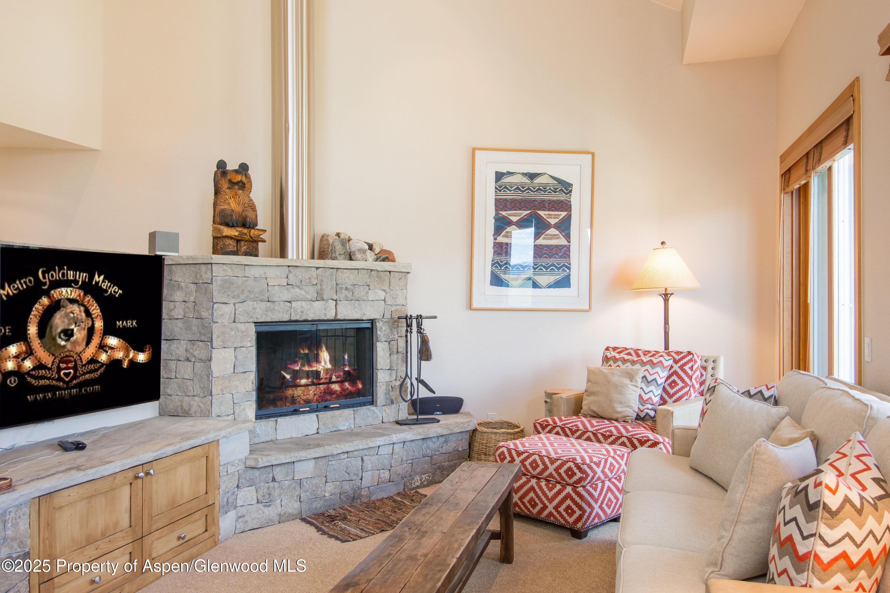 425 Wood Road, Unit 48 Snowmass Village, CO 81615 - Photo 6 of 41 a living room with furniture and a fireplace