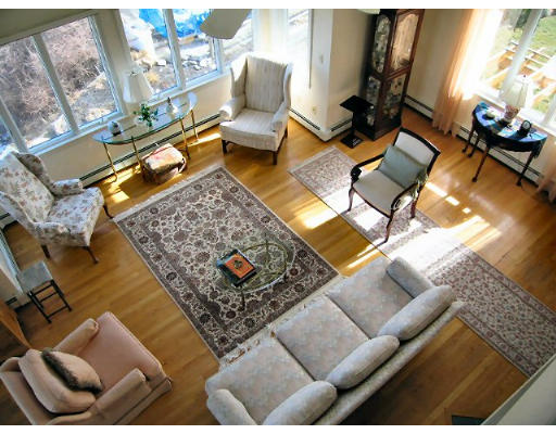 6 B Cliff Estates Road, Unit 6B Scituate, MA 02066 - Photo 8 of 28 a living room with furniture and a rug