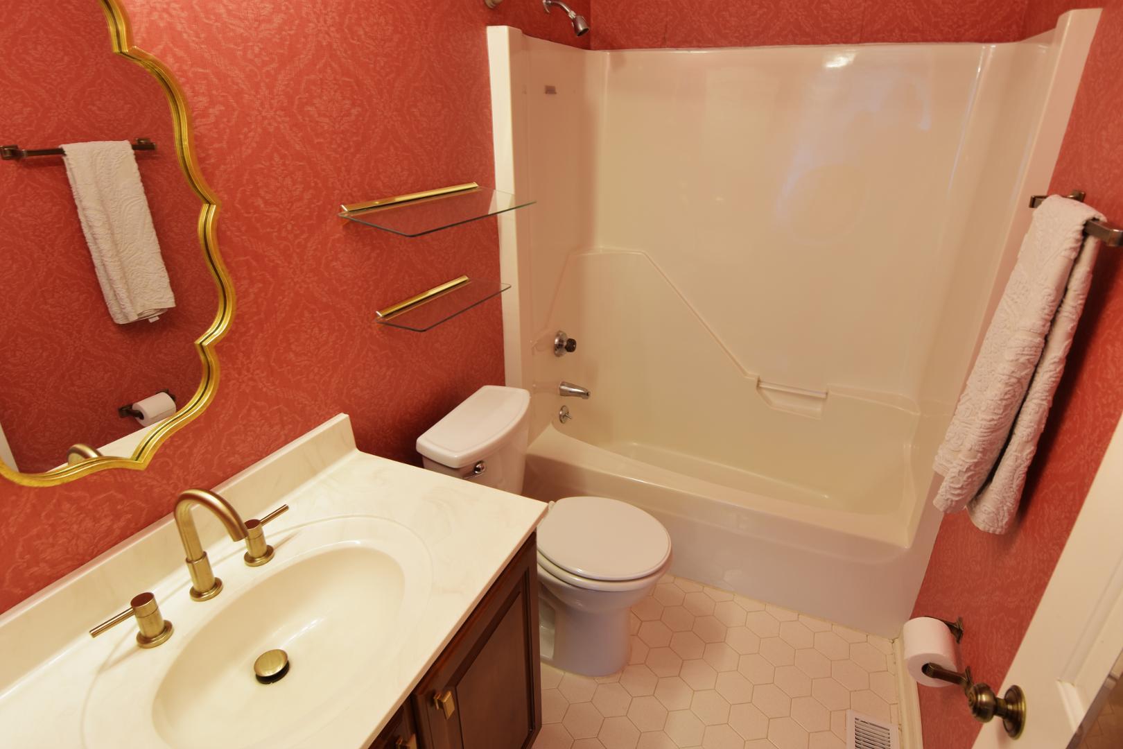 6403 Andsley Drive Raleigh, NC 27609 - Photo 13 of 18 a bathroom with a sink a toilet and shower
