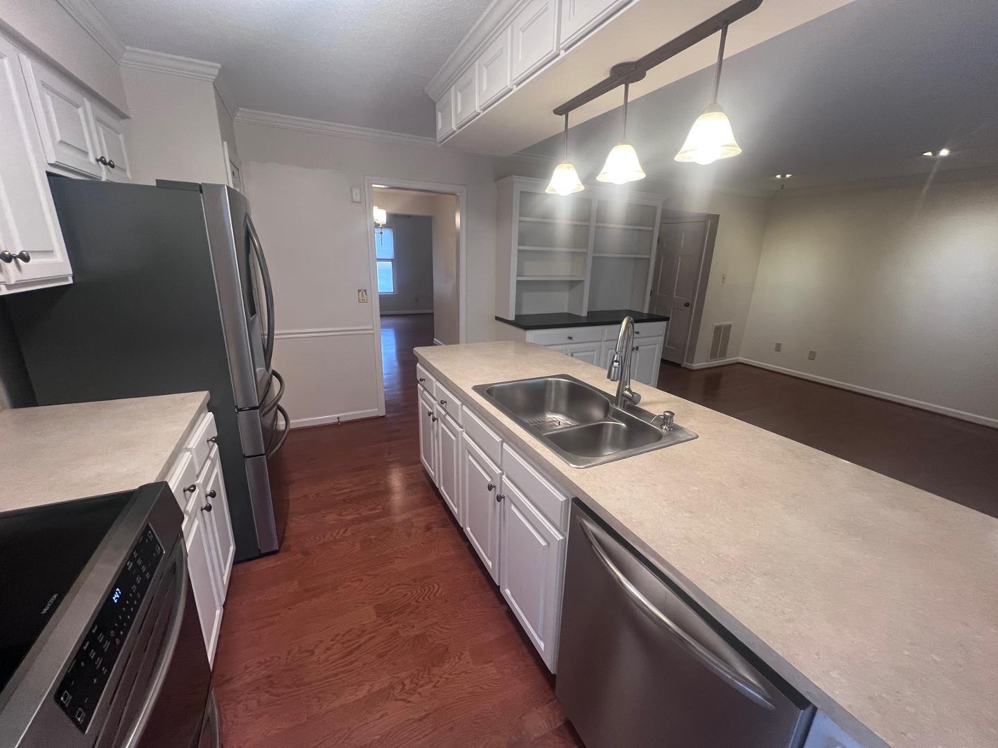 6403 Andsley Drive Raleigh, NC 27609 - Photo 4 of 18 a kitchen with a stove and a refrigerator