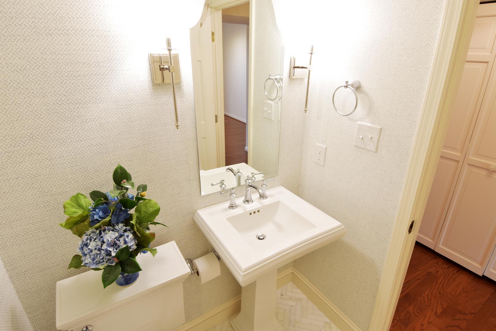 6403 Andsley Drive Raleigh, NC 27609 - Photo 8 of 18 a bathroom with a sink a mirror and a shower curtain