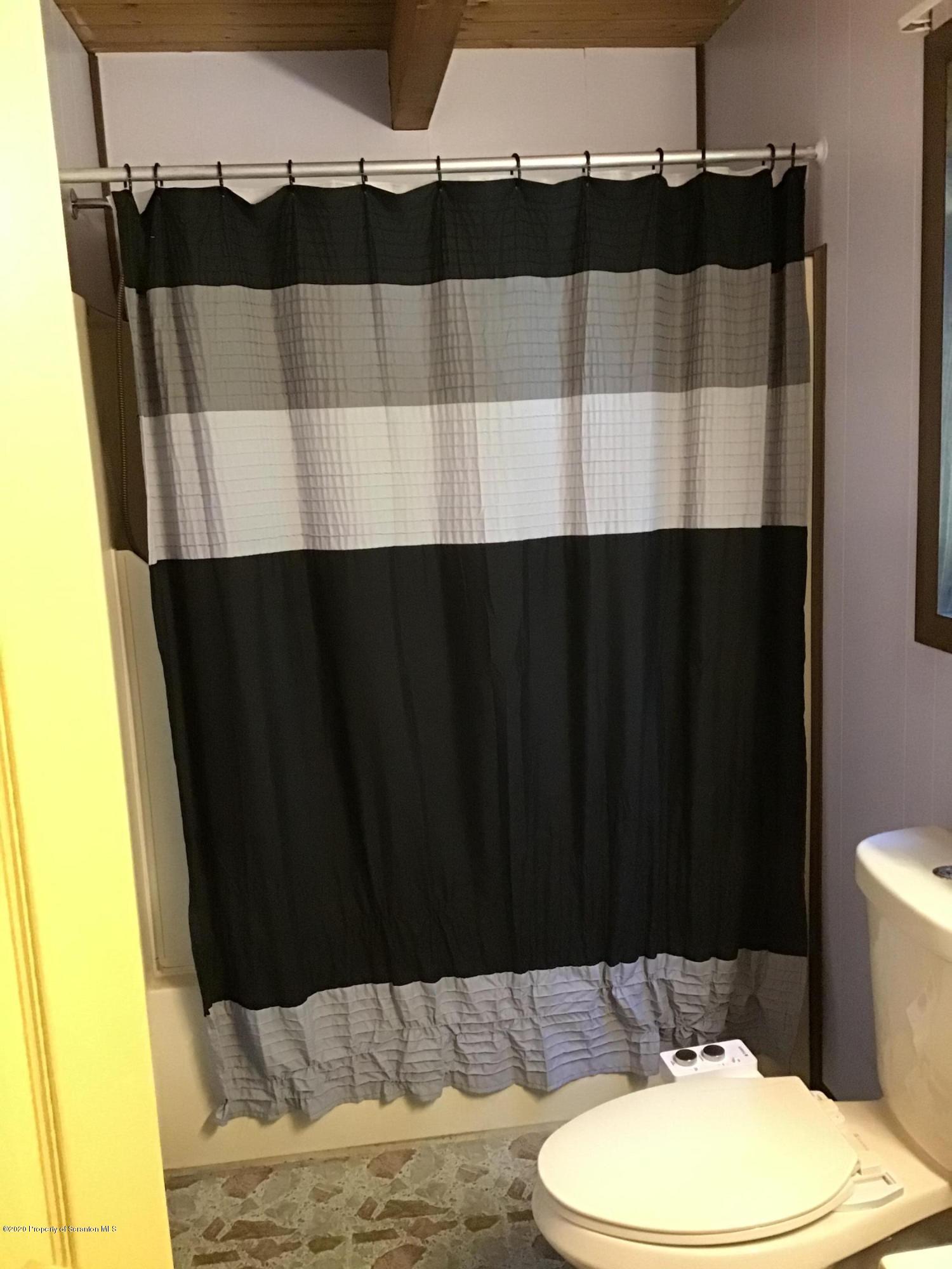 199 Eskra Road Lake Ariel, PA 18436 - Photo 14 of 36 a bathroom with a sink and a mirror