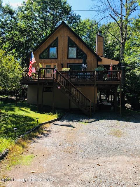 199 Eskra Road Lake Ariel, PA 18436 - Photo 23 of 36 a view of a blue house with a yard