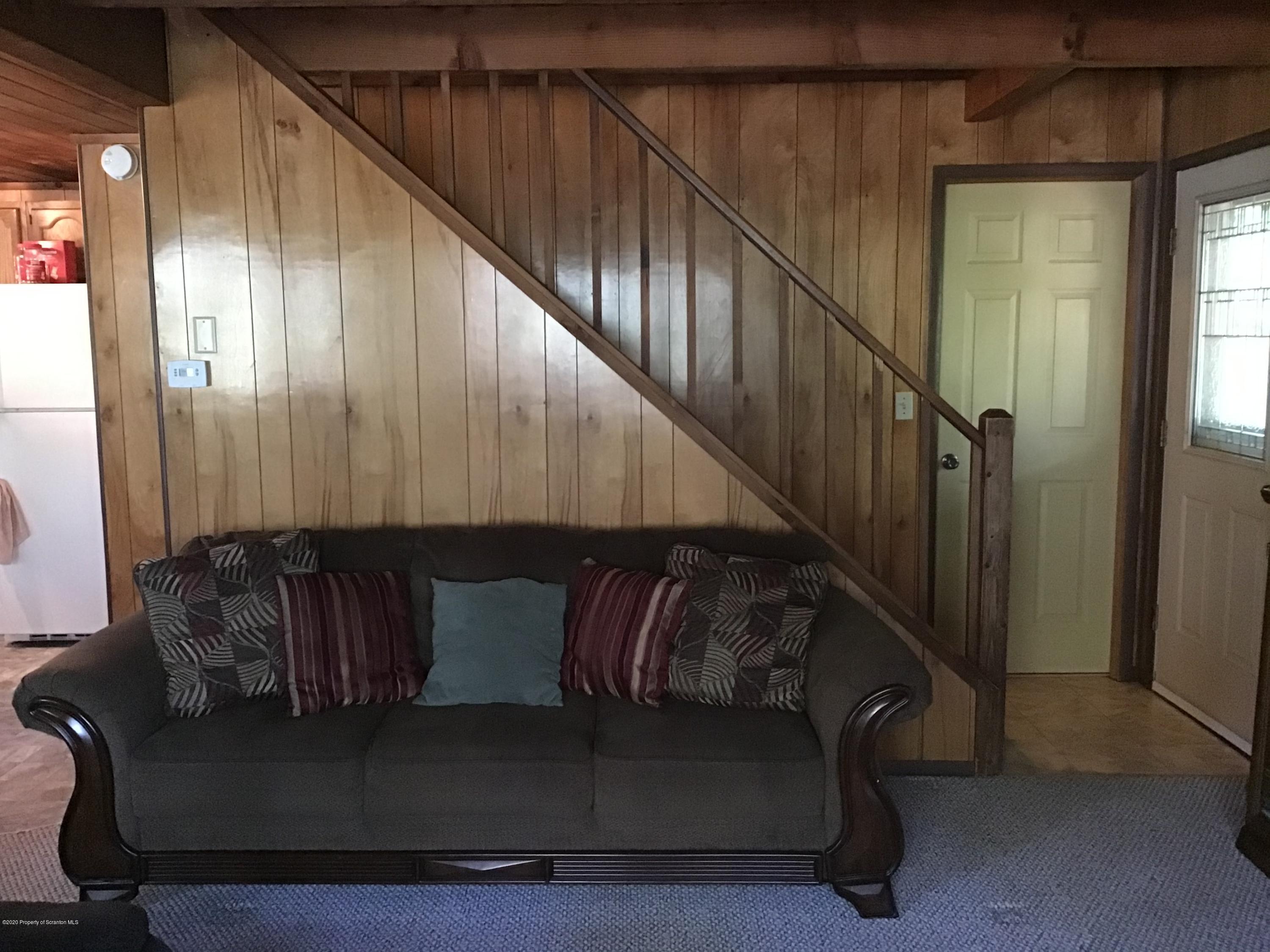 199 Eskra Road Lake Ariel, PA 18436 - Photo 5 of 36 a living room with furniture and stairs