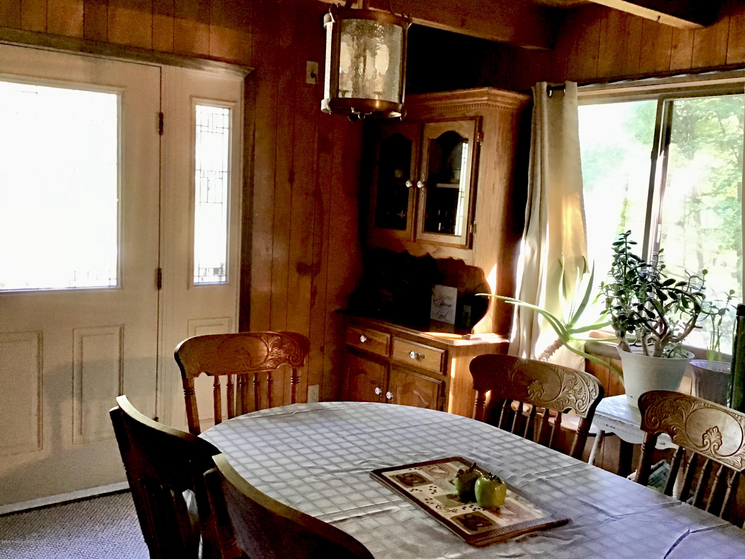199 Eskra Road Lake Ariel, PA 18436 - Photo 6 of 36 a view of a dining room with furniture and a window