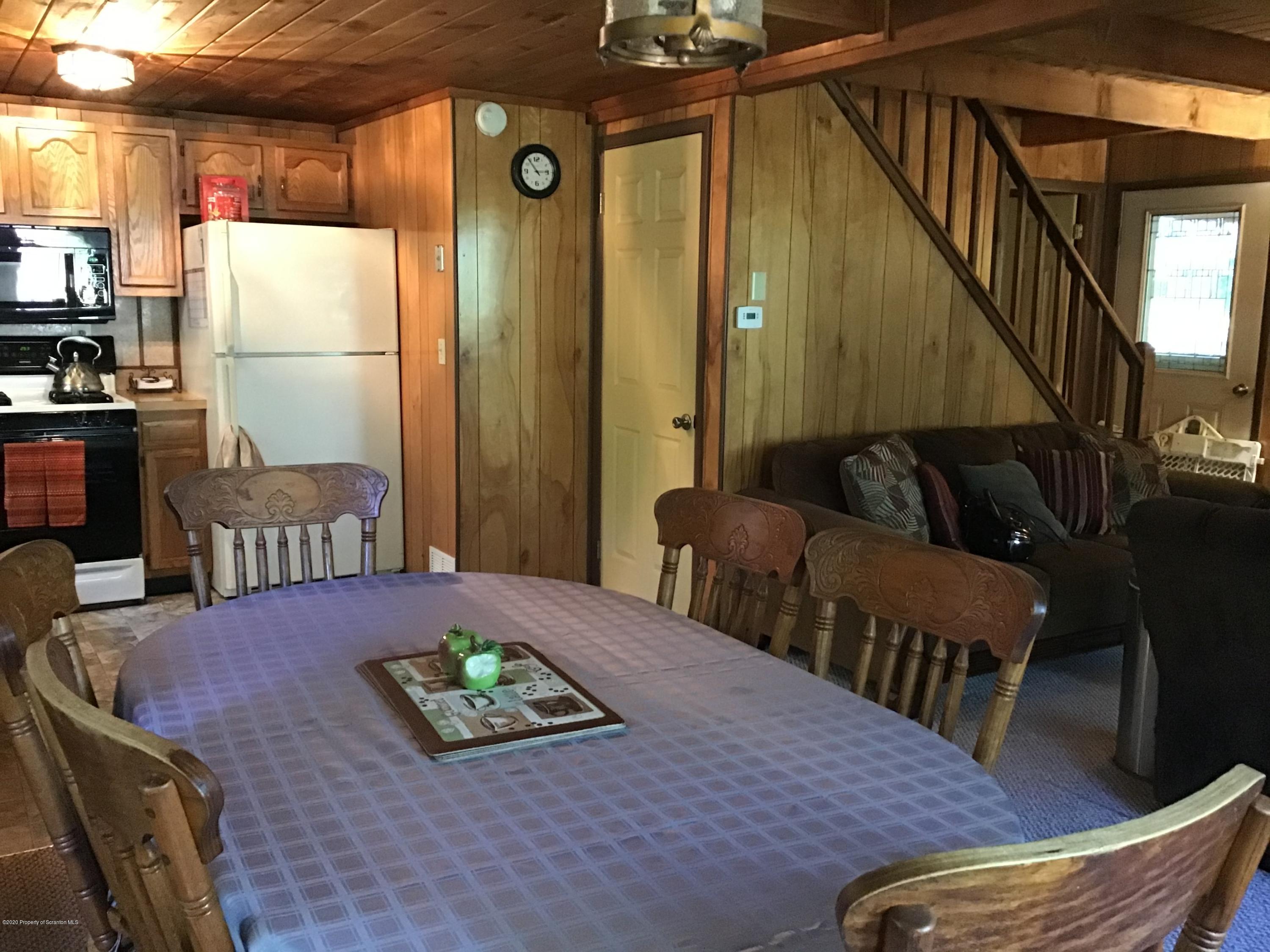199 Eskra Road Lake Ariel, PA 18436 - Photo 7 of 36 a bedroom with furniture and a wooden floor