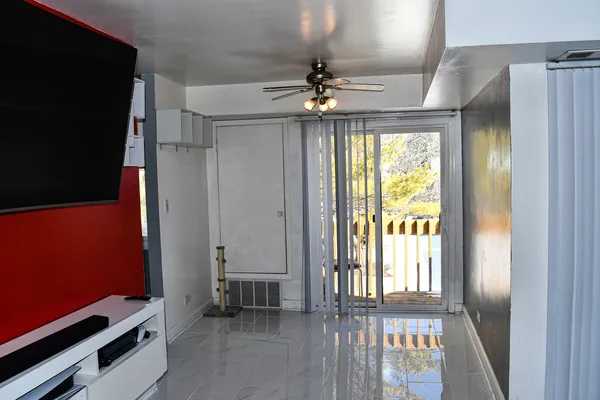a view of an empty room with a window