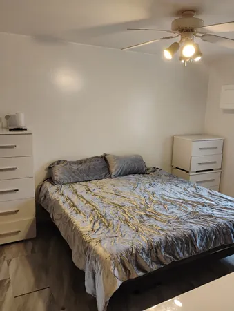a bedroom with a bed and a cabinets