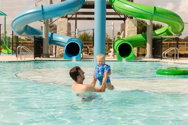 a view of a swimming pool with a patio