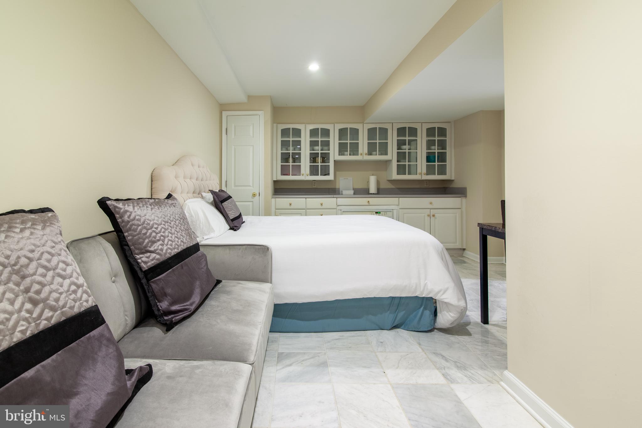 6034 Chesterbrook Road, Unit B McLean, VA 22101 - Photo 13 of 19 a bedroom with a bed and window