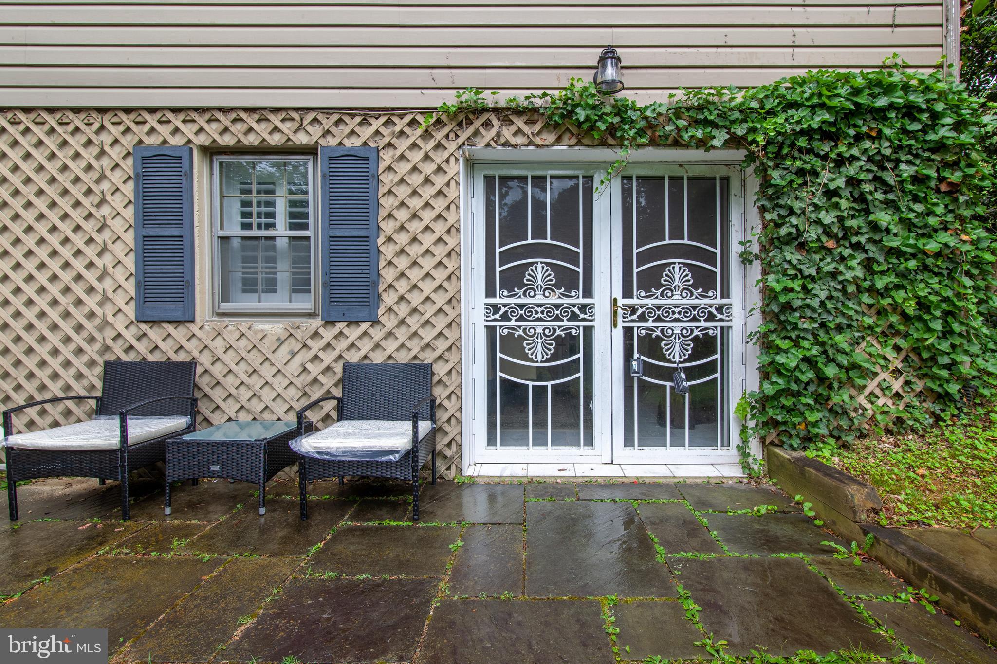 6034 Chesterbrook Road, Unit B McLean, VA 22101 - Photo 2 of 19 a view of a patio with table and chairs and potted plants