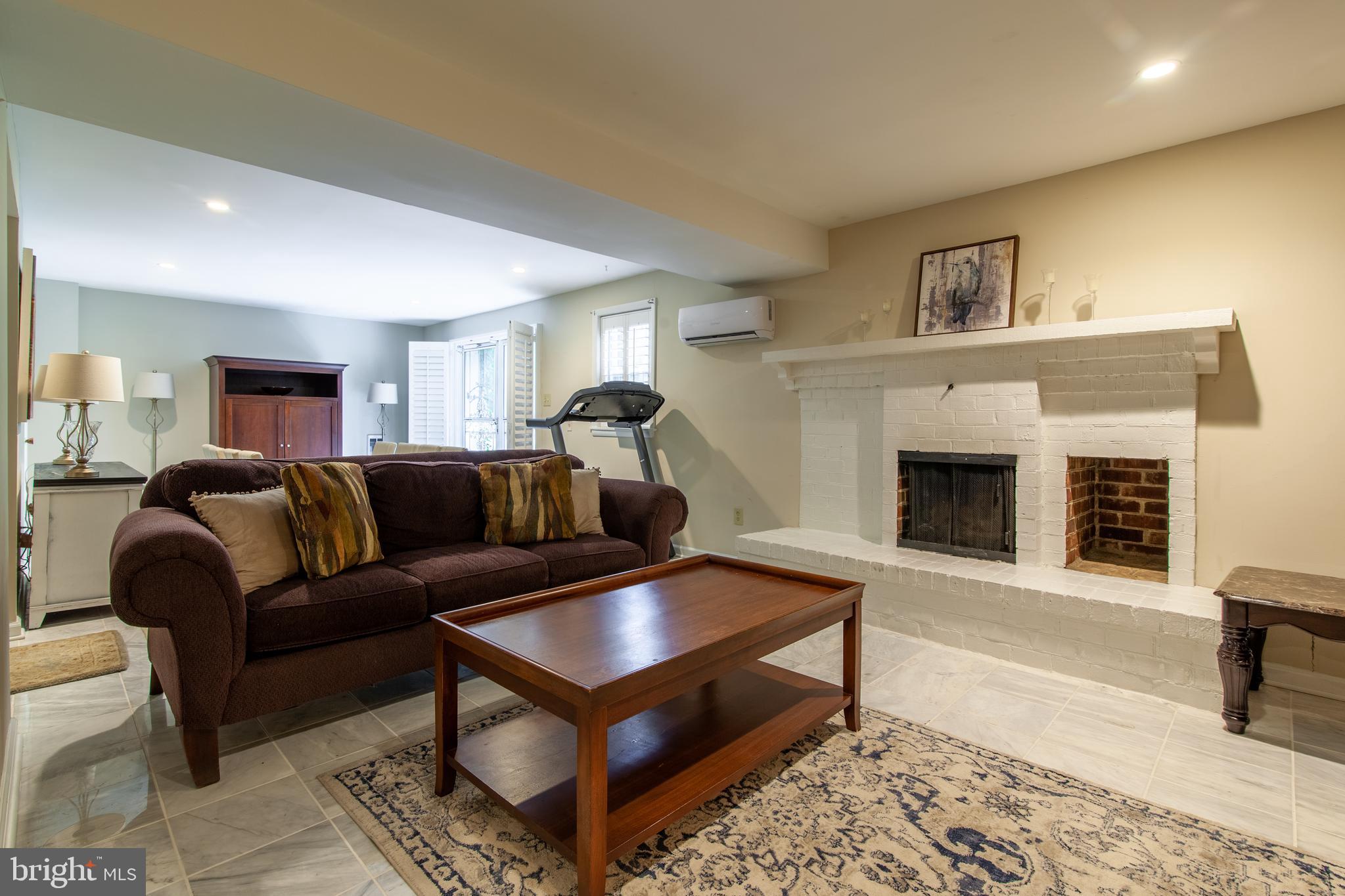 6034 Chesterbrook Road, Unit B McLean, VA 22101 - Photo 3 of 19 a living room with furniture and a fireplace