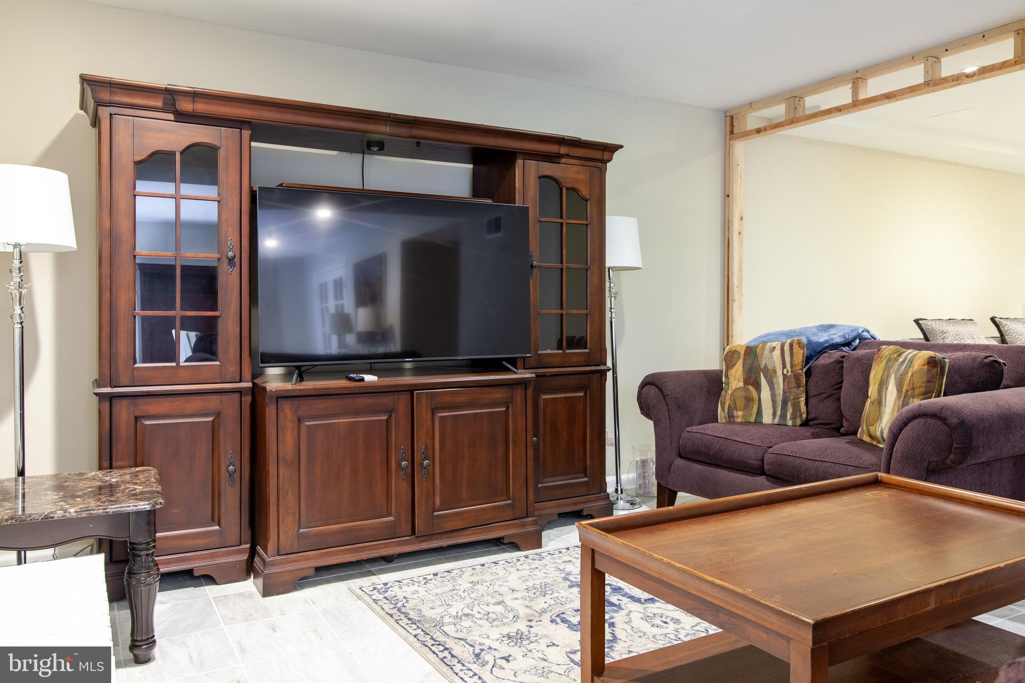 6034 Chesterbrook Road, Unit B McLean, VA 22101 - Photo 4 of 19 a living room with furniture and a flat screen tv