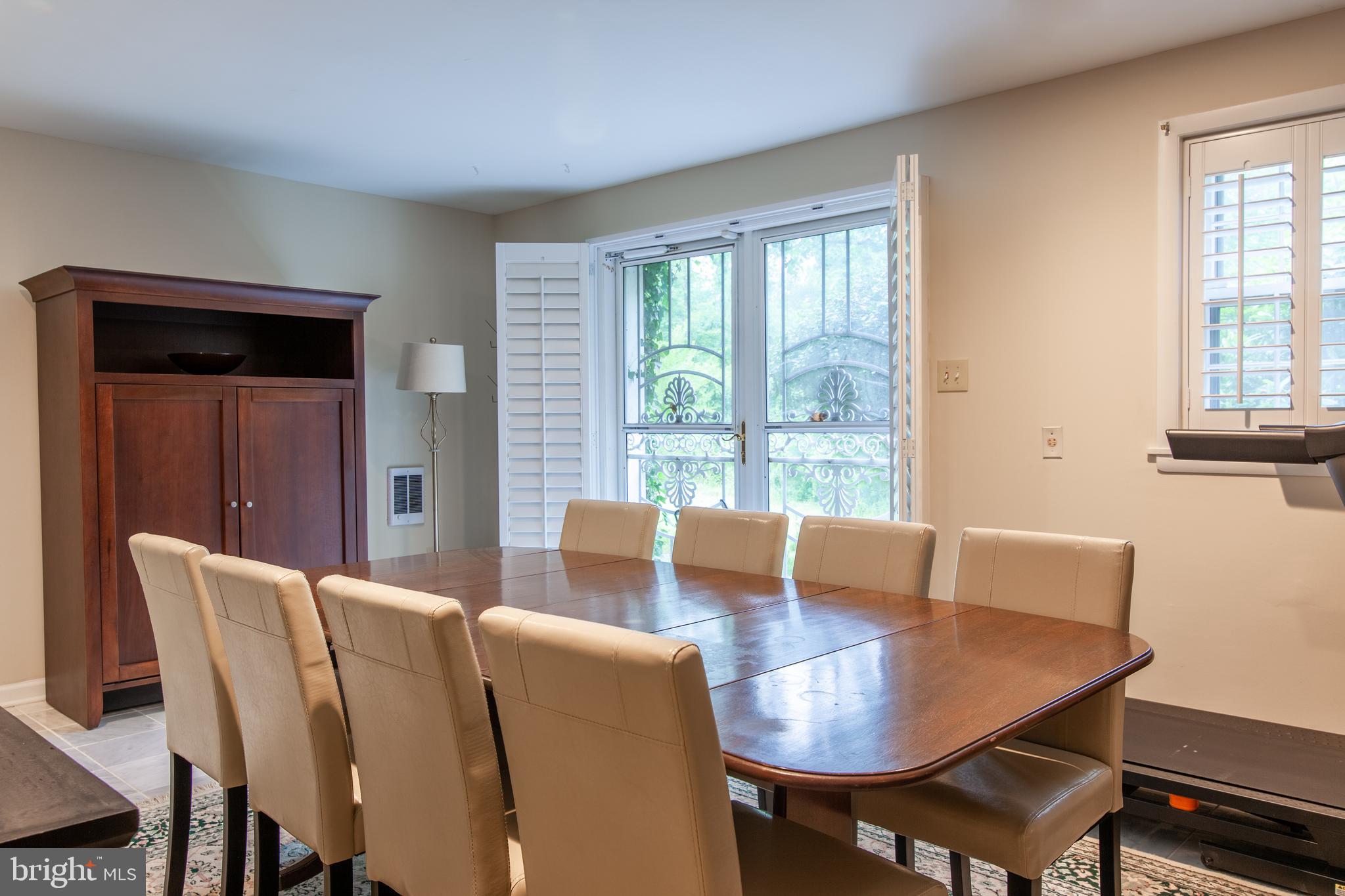 6034 Chesterbrook Road, Unit B McLean, VA 22101 - Photo 5 of 19 a view of a dining room with furniture window and outside view