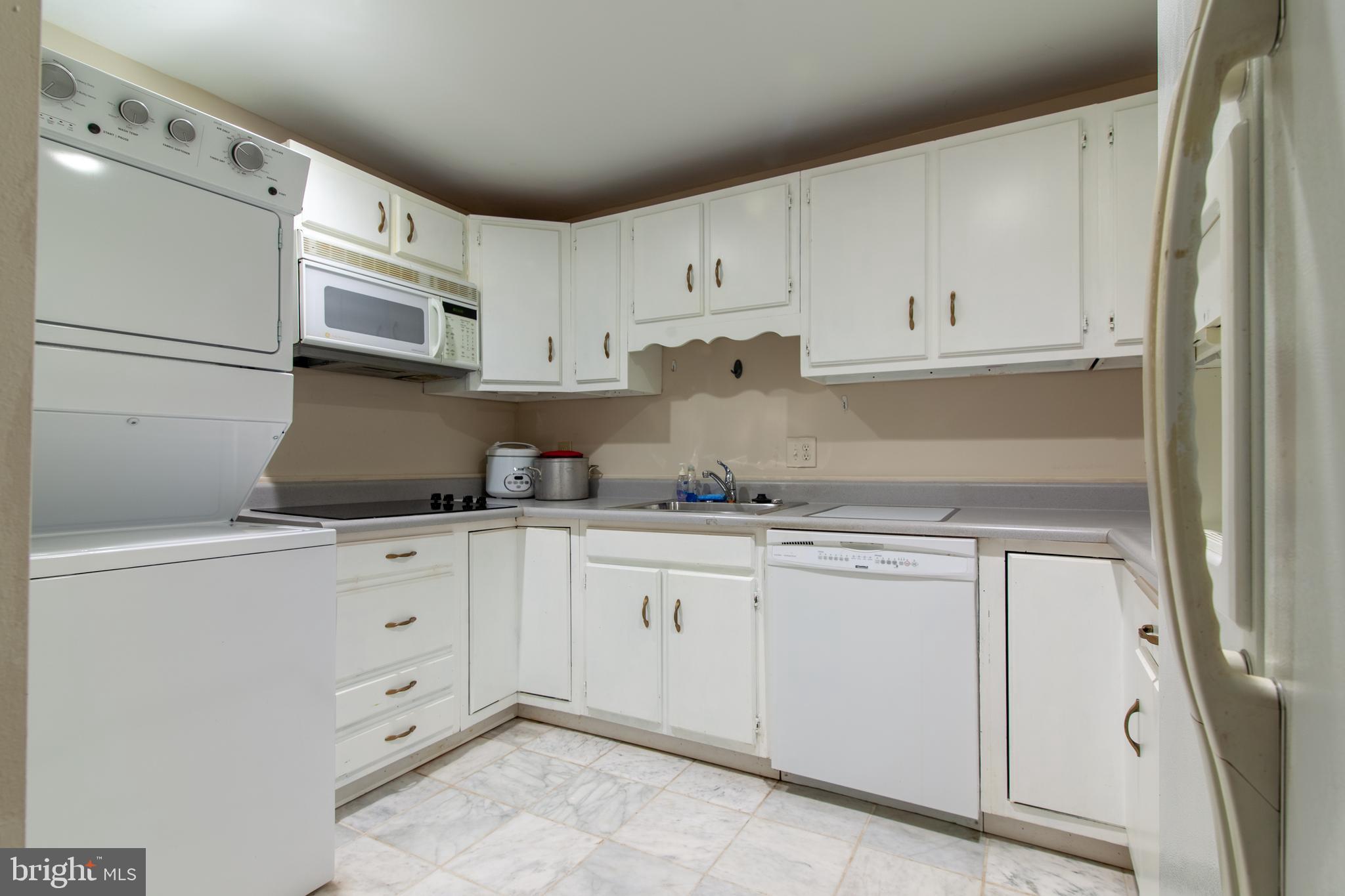6034 Chesterbrook Road, Unit B McLean, VA 22101 - Photo 7 of 19 a kitchen with granite countertop white cabinets and white appliances