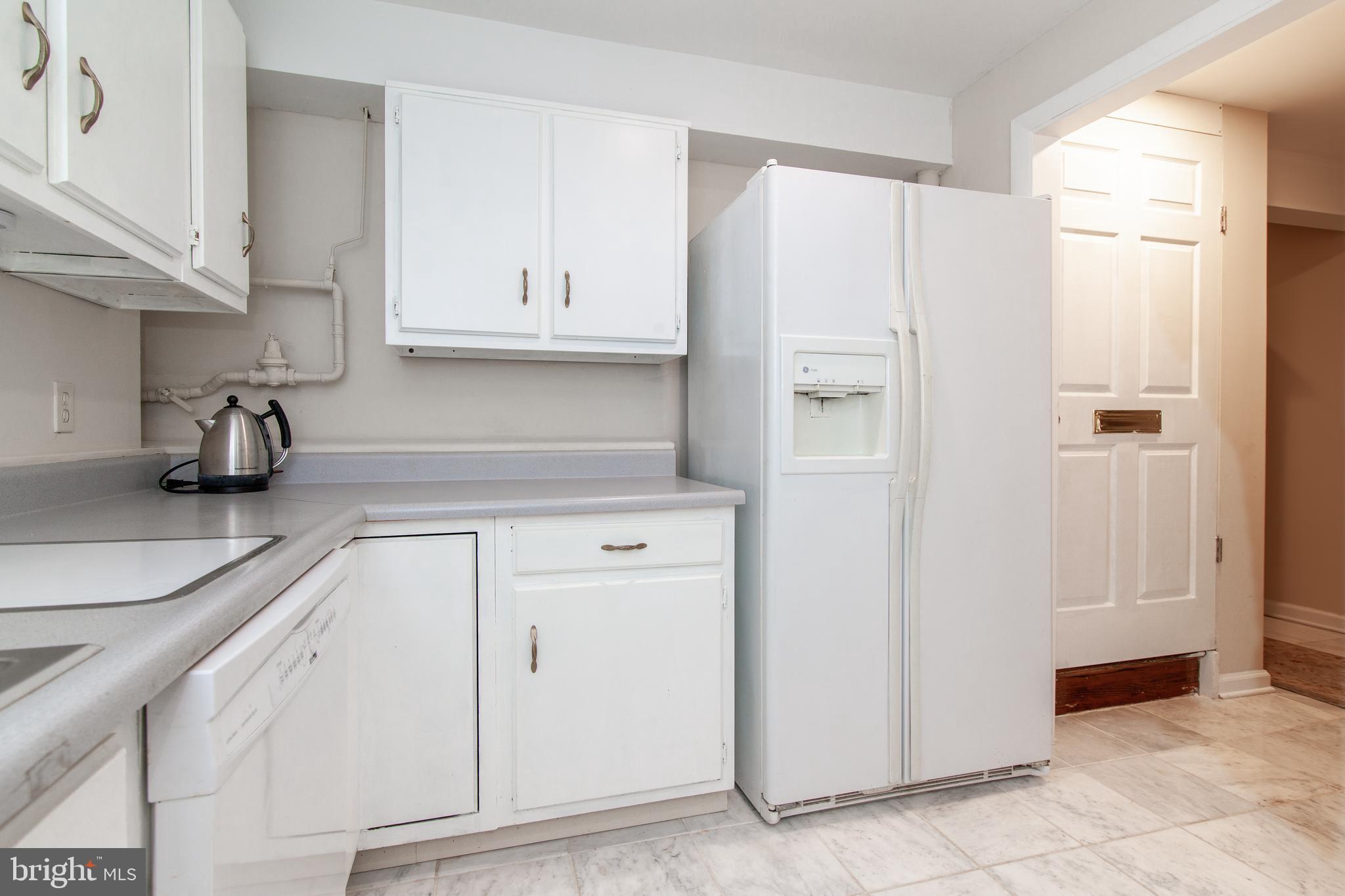 6034 Chesterbrook Road, Unit B McLean, VA 22101 - Photo 8 of 19 a kitchen with cabinets and a refrigerator