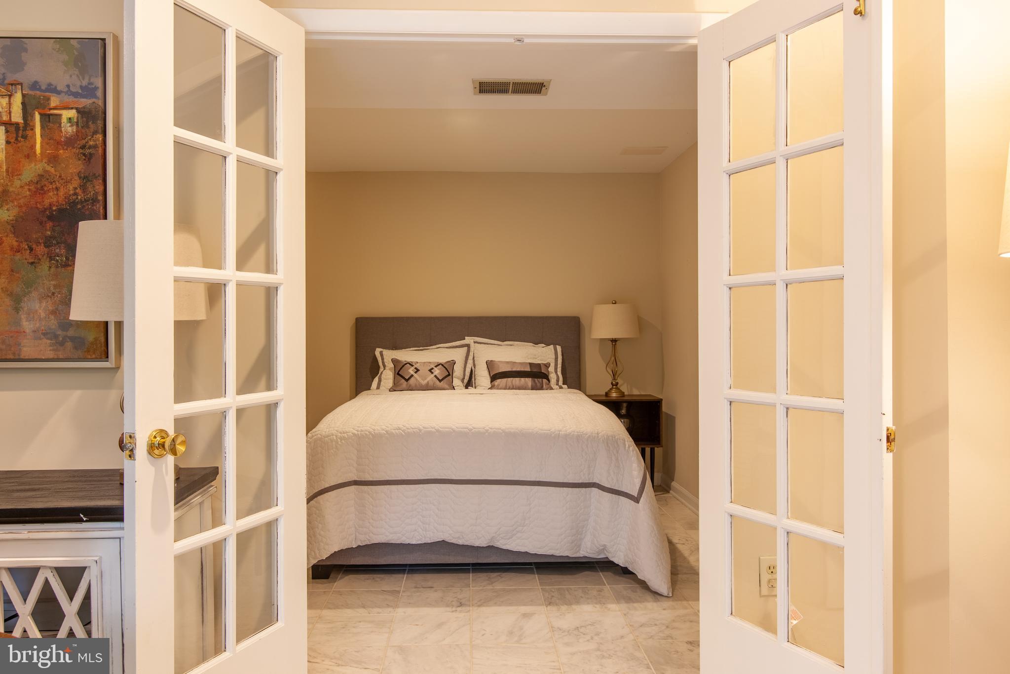 6034 Chesterbrook Road, Unit B McLean, VA 22101 - Photo 10 of 19 a bedroom with a bed and a window