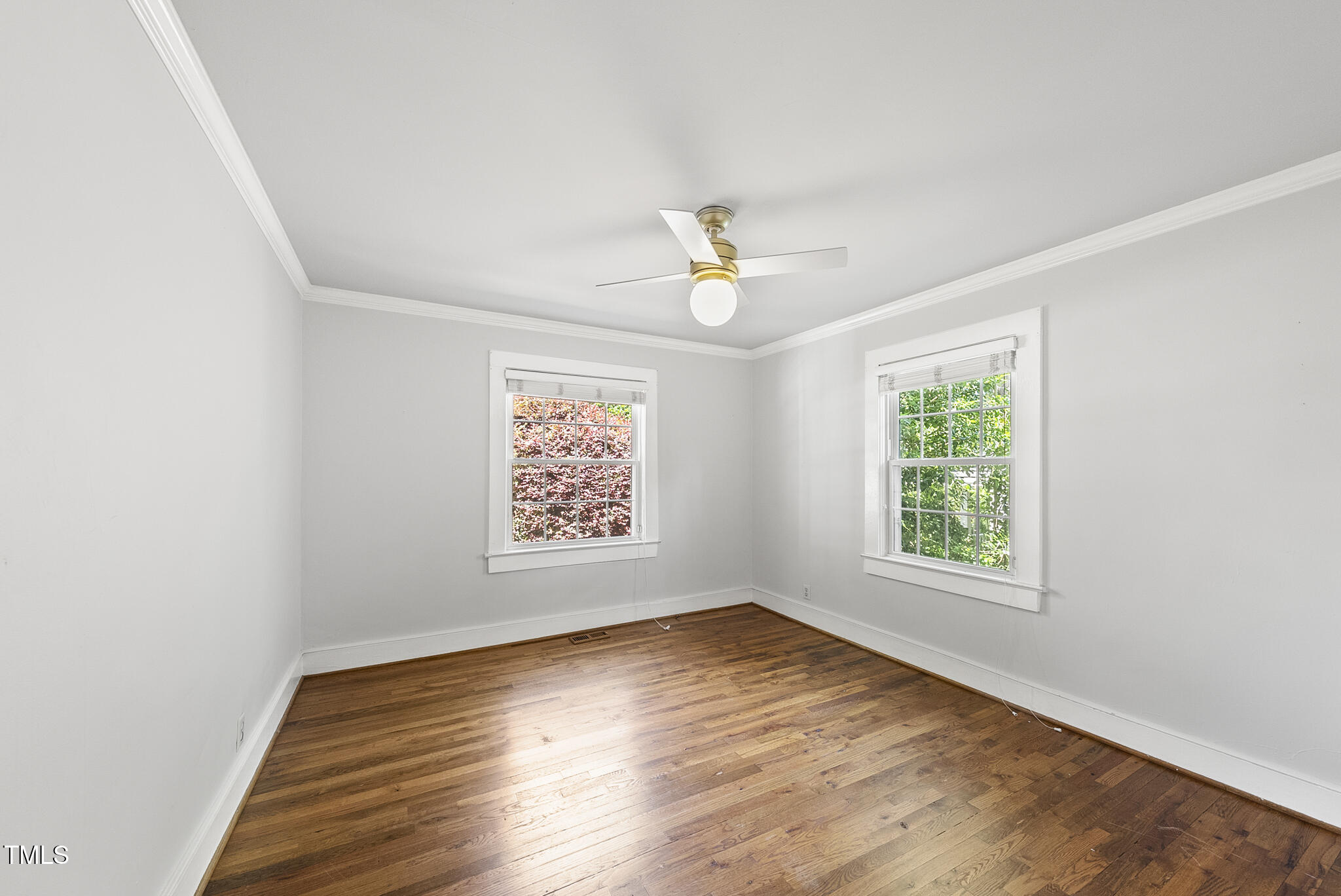 1812 Hilton Street Raleigh, NC 27608 - Photo 20 of 31 an empty room with wooden floor and window