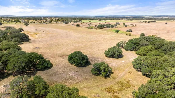 a view of yard covered with snow in front of house