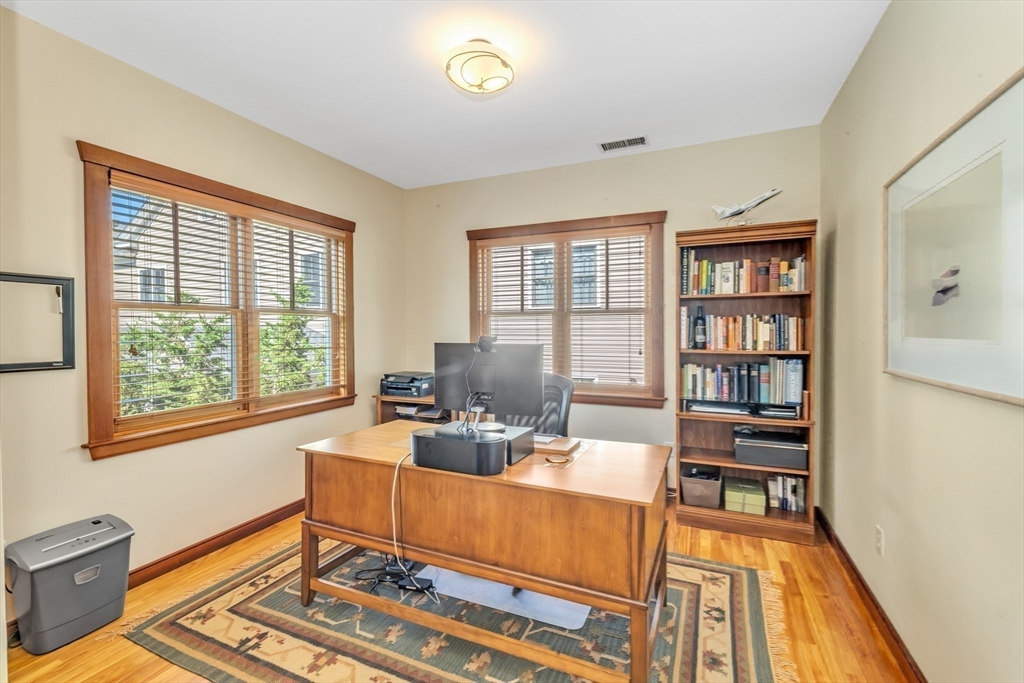 53 B Burroughs Street Boston, MA 02130 - Photo 14 of 41 a work room with furniture wooden floor and a book shelf
