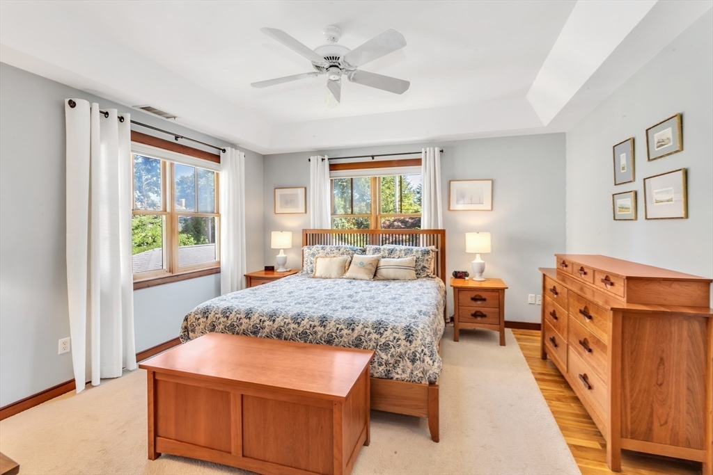 53 B Burroughs Street Boston, MA 02130 - Photo 16 of 41 a bedroom with a bed and wooden floor