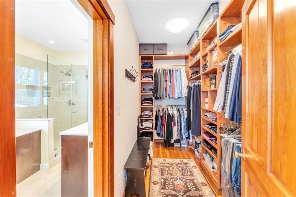 53 B Burroughs Street Boston, MA 02130 - Photo 18 of 41 a view of walk in closet with clothes and shoes