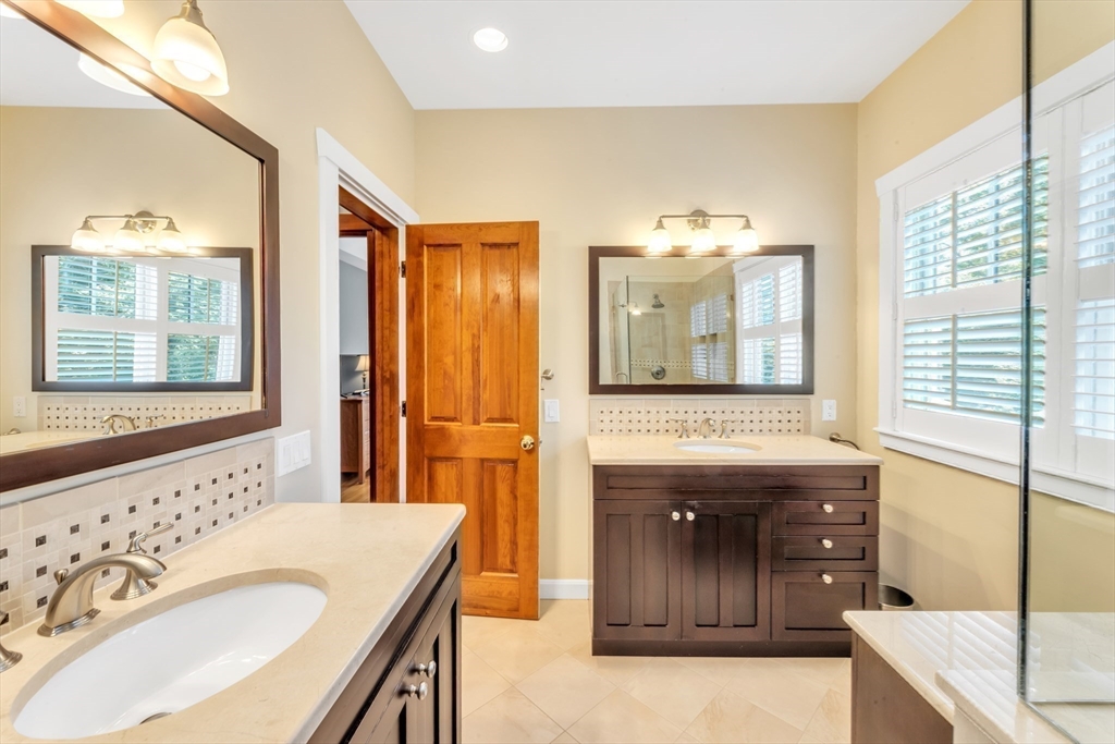 53 B Burroughs Street Boston, MA 02130 - Photo 20 of 41 a bathroom with a tub sink and mirror