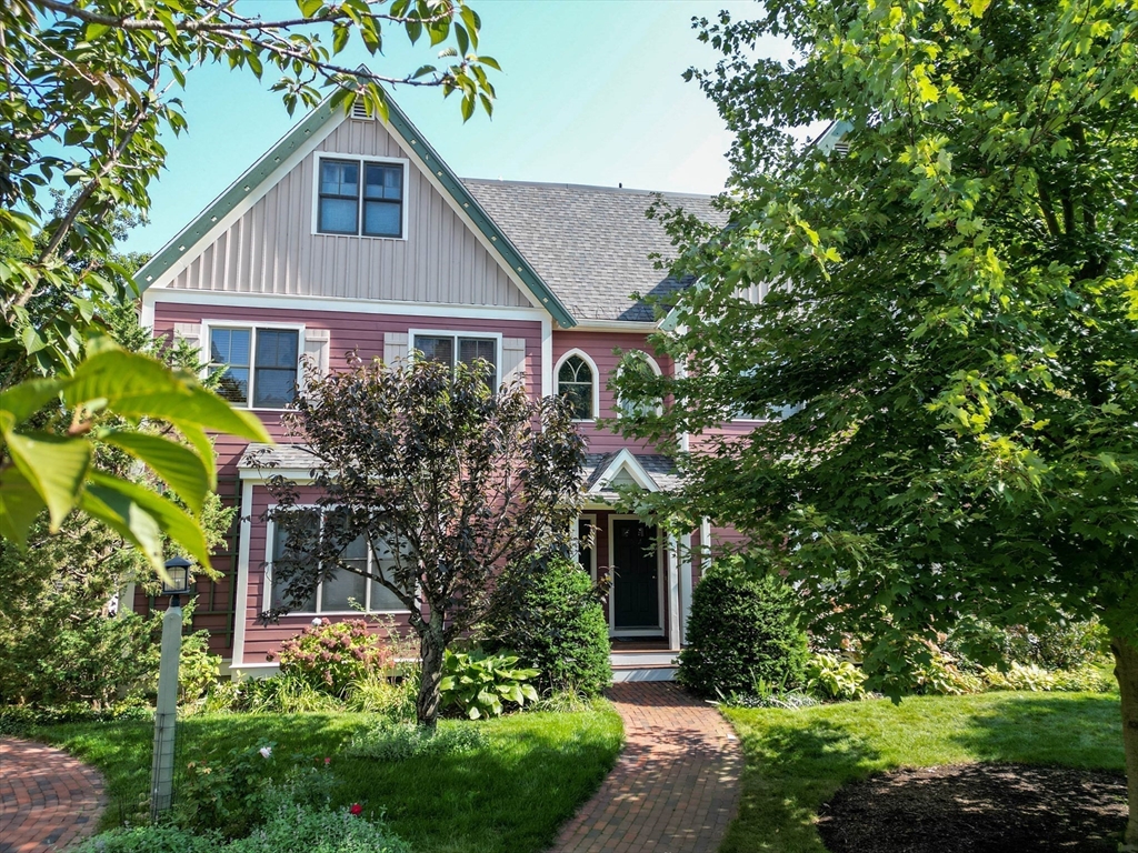 53 B Burroughs Street Boston, MA 02130 - Photo 2 of 41 a front view of a house with a yard and potted plants