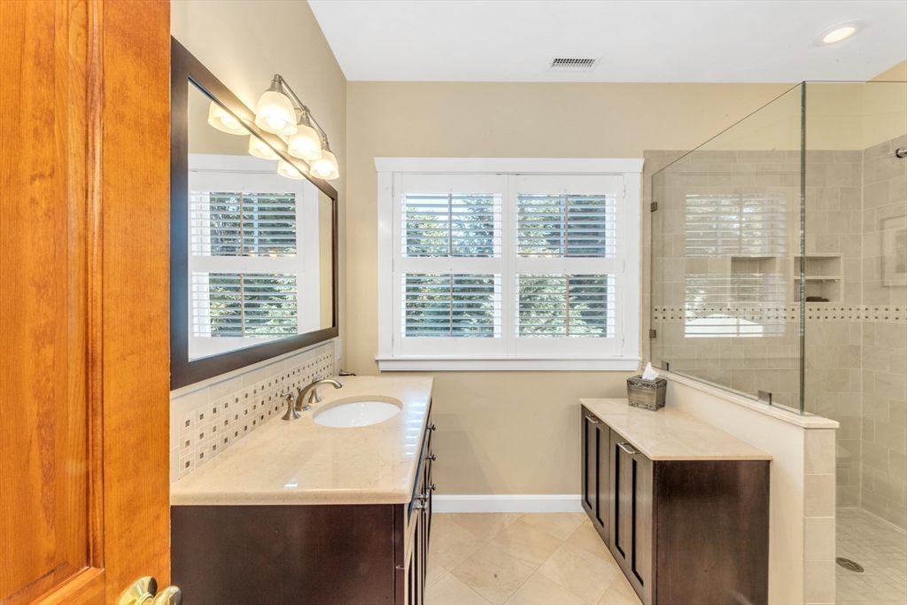 53 B Burroughs Street Boston, MA 02130 - Photo 21 of 41 a bathroom with a sink and a bathtub