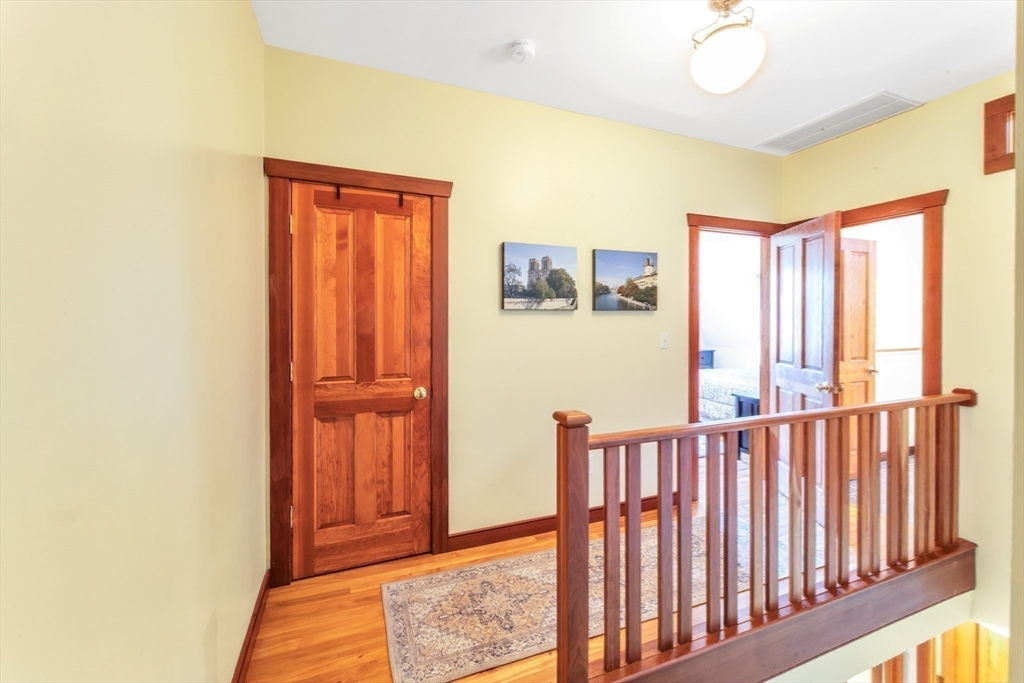 53 B Burroughs Street Boston, MA 02130 - Photo 22 of 41 a view of a hallway with windows