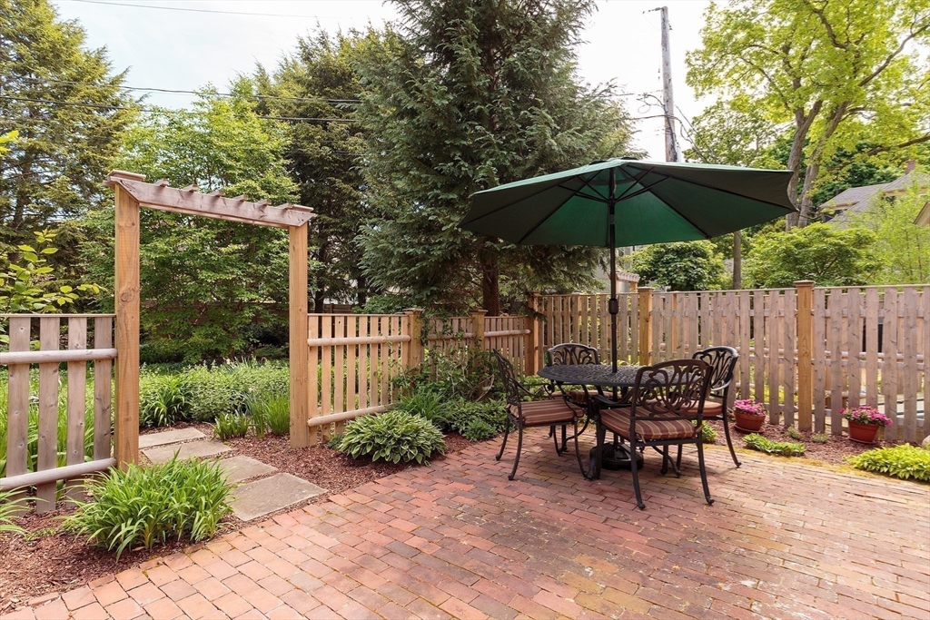 53 B Burroughs Street Boston, MA 02130 - Photo 27 of 41 a view of backyard with seating space and wooden fence