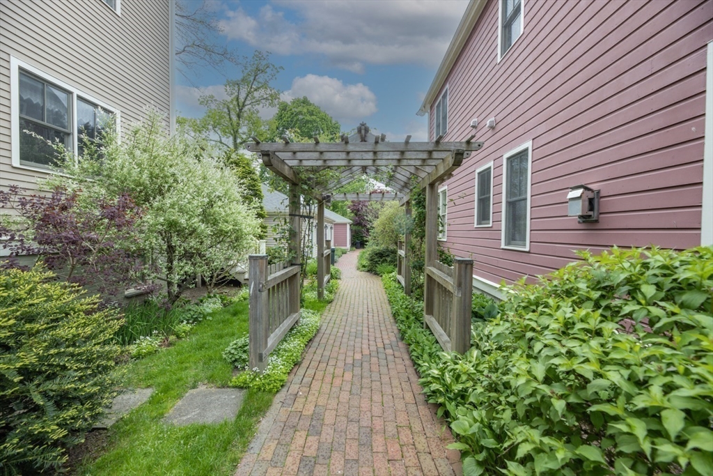 53 B Burroughs Street Boston, MA 02130 - Photo 28 of 41 a view of a pathway with house on both side