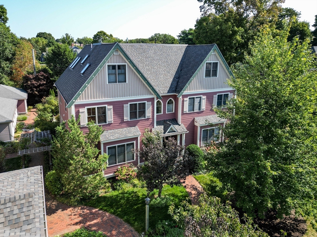 53 B Burroughs Street Boston, MA 02130 - Photo 3 of 41 a aerial view of a house with a yard and potted plants