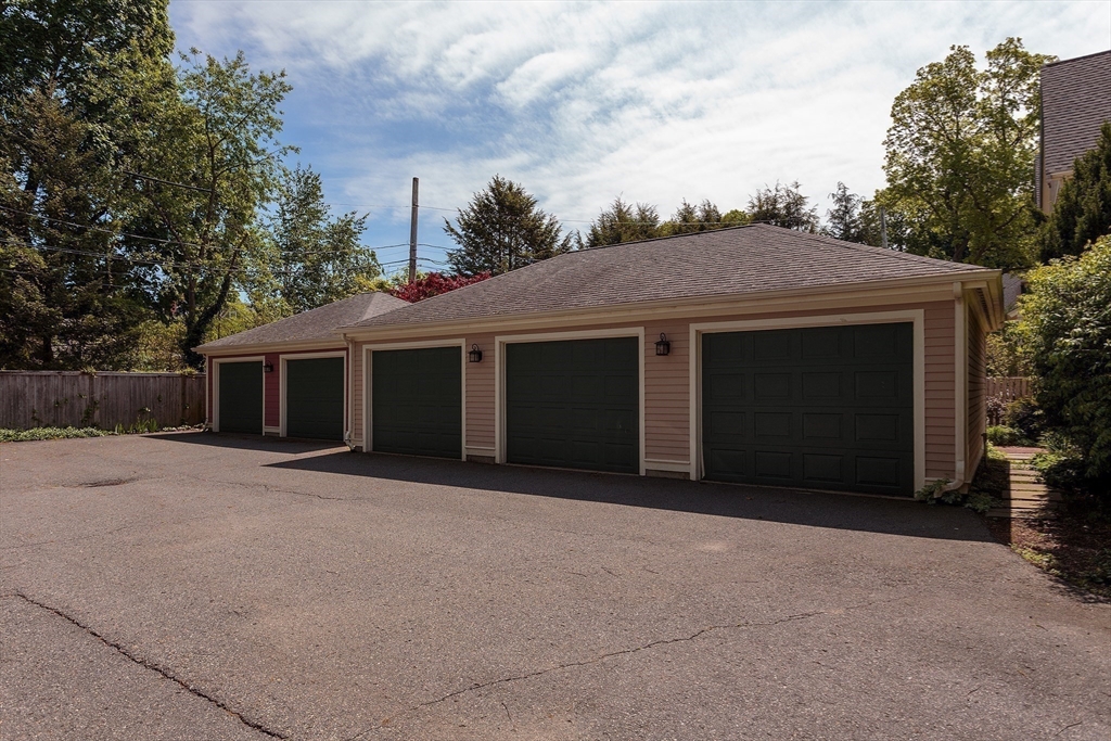 53 B Burroughs Street Boston, MA 02130 - Photo 32 of 41 a front view of a house with a garage