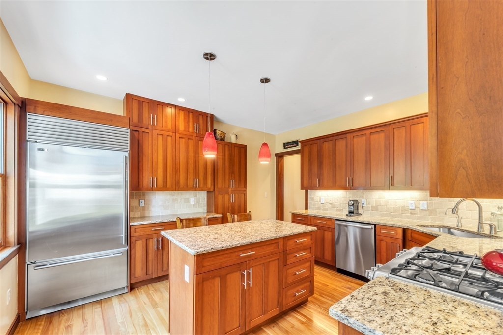 53 B Burroughs Street Boston, MA 02130 - Photo 10 of 41 a kitchen with a sink stove and cabinets