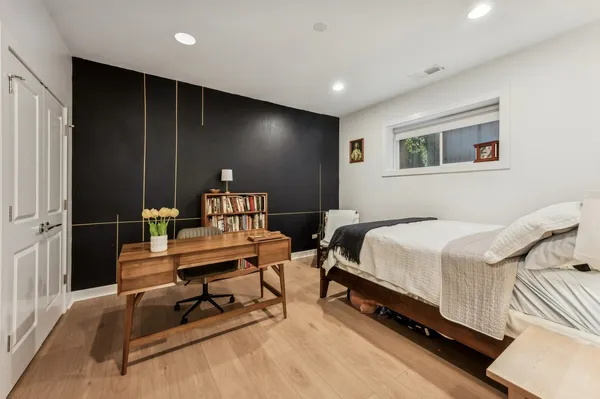 a view of bedroom with furniture and window